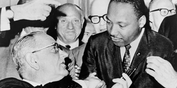 President Lyndon Baines Johnson Giving Dr. Martin Luther King a Pen as He Signs the Voting Rights Act