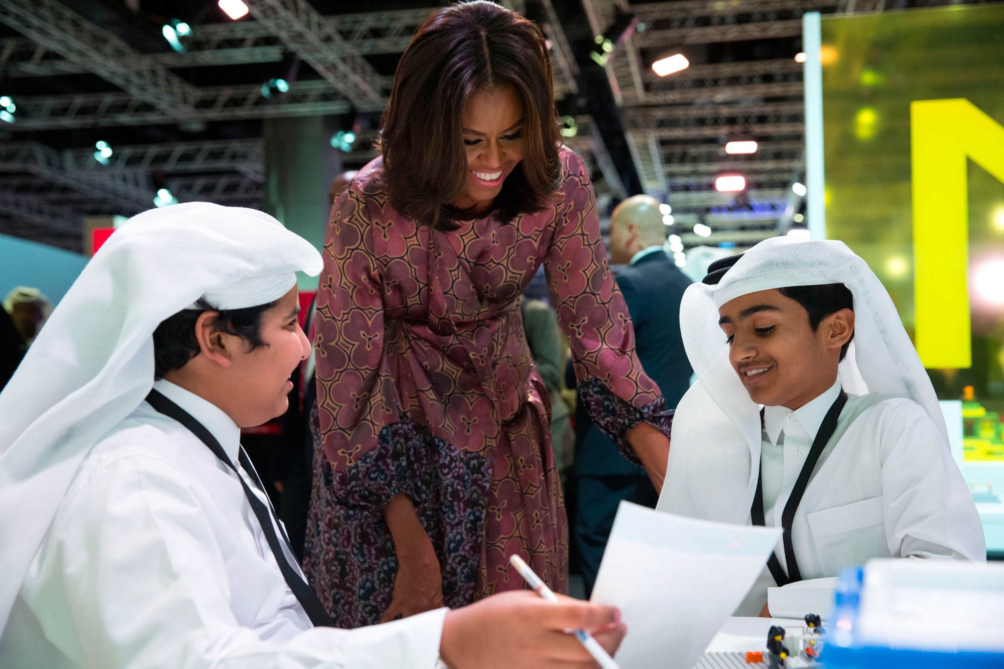 First Lady Michelle Obama talks with students during a tour of the WISE Summit Learning Labs during the 2015 World Innovation Summit for Education at the Qatar National Convention Centre in Doha, Qatar, Nov. 4, 2015. (Official White House Photo by Amanda Lucidon)