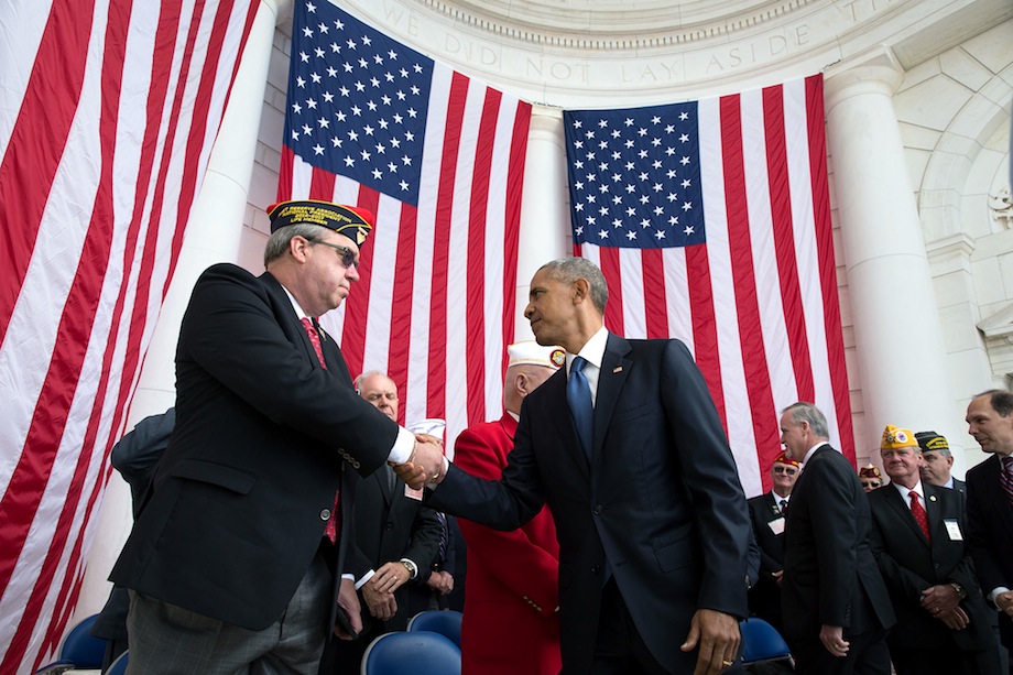 President Barack Obama shakes the hand of Donald E. Larson, National President of the Fleet Reserve Association, after delivering remarks during a Veterans Day ceremony at the Memorial Amphitheater at Arlington National Cemetery in Arlington, Virginia, Nov. 11, 2016. (Official White House Photo by Pete Souza)
