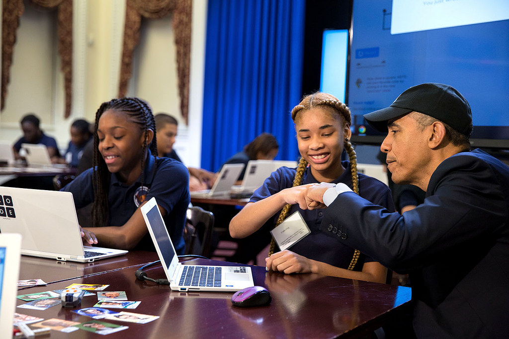 President Barack Obama fist bumps a middle-school student participating in an "Hour of Code" event to honor Computer Science Education Week in the Eisenhower Executive Office Building, Dec. 8, 2014. (Official White House Photo by Pete Souza)