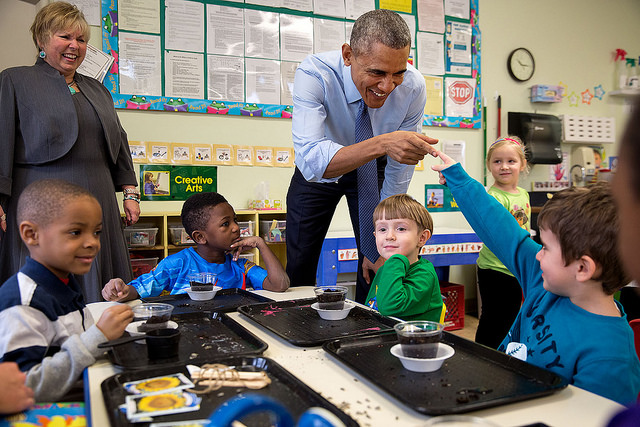 President Barack Obama and a young student touch fingers during a visit to the Community Children's Center, one of the nation's oldest Head Start providers, in Lawrence, Kan., Jan. 22, 2015. (Official White House Photo by Pete Souza)