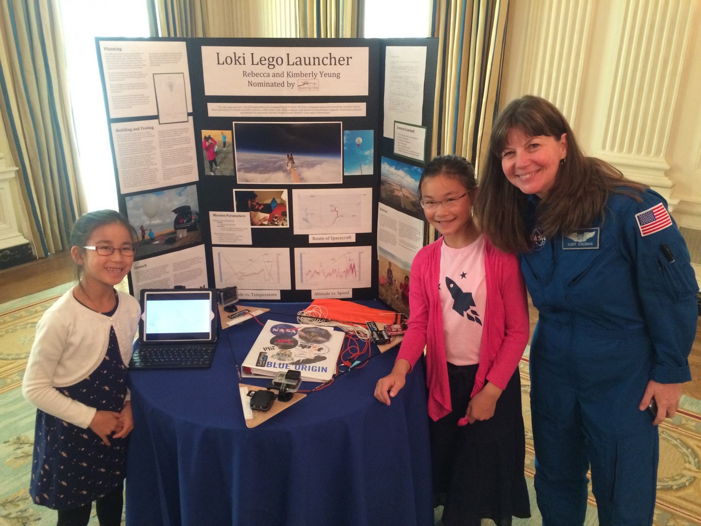 Kimberly (left) and Rebecca Yeung of Seattle, WA, ages 9 and 11, pose with astronaut Cady Coleman at the 2016 White House Science Fair. (Photo credit: Jenn Gustetic)