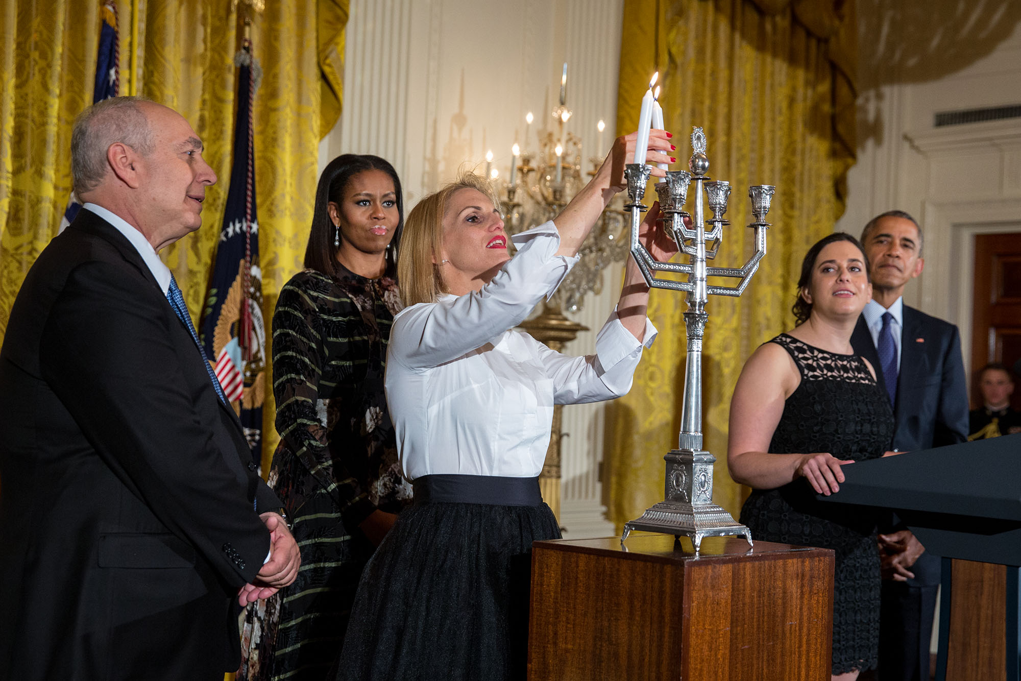 President Barack Obama, First Lady Michelle and Rabbi Rachel Isaacs join Chemi Peres and Mika Almog for the menorah lighting during Hanukkah in the East Room of the White House, Dec. 14, 2016. (Official White House Photo by Chuck Kennedy)