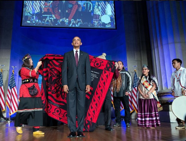 President Barack Obama being honored with a blanket ceremony and song during the 8th White House Tribal Nations Conference in Washington, D.C., September 29, 2016.